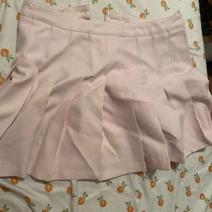 Light pink pleated mini skirt